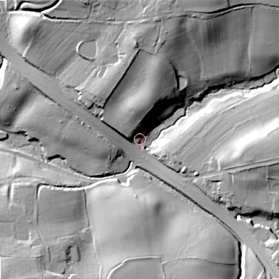 Shaded relief map of the ground around DY99UJ, computed from Environment Agency LiDAR. The ground here sits at about 135 m above sea level and falls 35 m across the surrounding 800 m. Surface water reaching this point runs off ground lying to the north-north-east, 30.3 m higher.