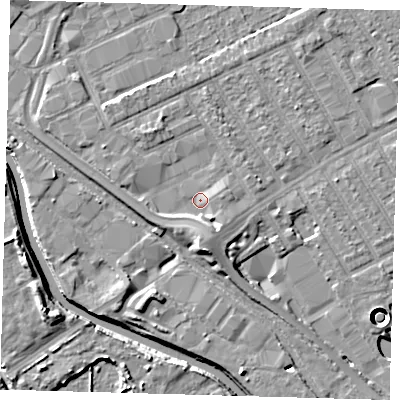 Shaded relief map of the ground around E107GA, computed from Environment Agency LiDAR. The ground here sits at about 7 m above sea level and falls 11 m across the surrounding 800 m. Surface water reaching this point runs off ground lying to the south-south-east, 3.2 m higher.