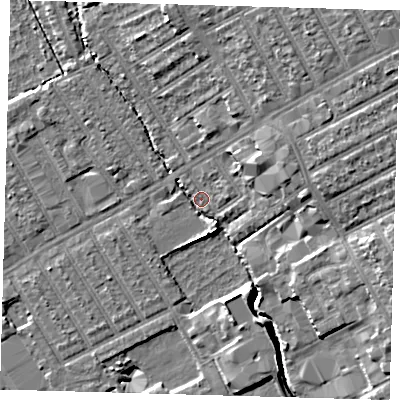 Shaded relief map of the ground around E107LH, computed from Environment Agency LiDAR. The ground here sits at about 6 m above sea level and falls 11 m across the surrounding 800 m. Surface water reaching this point runs off ground lying to the north-north-east, 8.8 m higher.