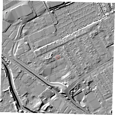 Shaded relief map of the ground around E107QA, computed from Environment Agency LiDAR. The ground here sits at about 7 m above sea level and falls 8 m across the surrounding 800 m. Surface water reaching this point runs off ground lying to the west, 1.7 m higher.