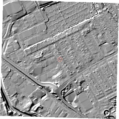 Shaded relief map of the ground around E107QG, computed from Environment Agency LiDAR. The ground here sits at about 7 m above sea level and falls 11 m across the surrounding 800 m. Surface water reaching this point runs off ground lying to the south, 3.2 m higher.