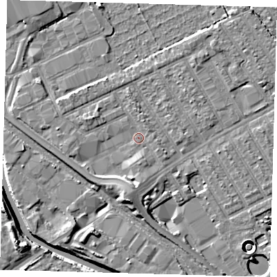 Shaded relief map of the ground around E107QQ, computed from Environment Agency LiDAR. The ground here sits at about 7 m above sea level and falls 11 m across the surrounding 800 m. Surface water reaching this point runs off ground lying to the south, 3.2 m higher.