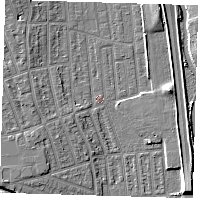 Shaded relief map of the ground around E125QX, computed from Environment Agency LiDAR. The ground here sits at about 4 m above sea level and falls 9 m across the surrounding 800 m. Surface water reaching this point runs off ground lying to the west, 7.2 m higher.