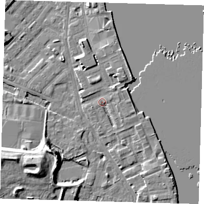 Shaded relief map of the ground around E143JB, computed from Environment Agency LiDAR. The ground here sits at about 4 m above sea level and falls 12 m across the surrounding 800 m. Surface water reaching this point runs off ground lying to the north-east, 2.4 m higher.