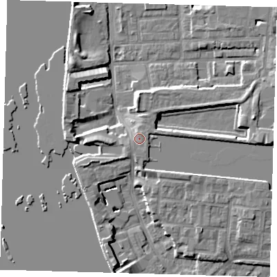 Shaded relief map of the ground around E143QS, computed from Environment Agency LiDAR. The ground here sits at about 5 m above sea level and falls 7 m across the surrounding 800 m. Surface water reaching this point runs off ground lying to the south-south-west, 1.2 m higher.