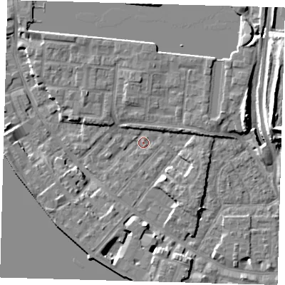 Shaded relief map of the ground around E143QT, computed from Environment Agency LiDAR. The ground here sits at about 2 m above sea level and falls 11 m across the surrounding 800 m. Surface water reaching this point runs off ground lying to the north, 4.4 m higher.
