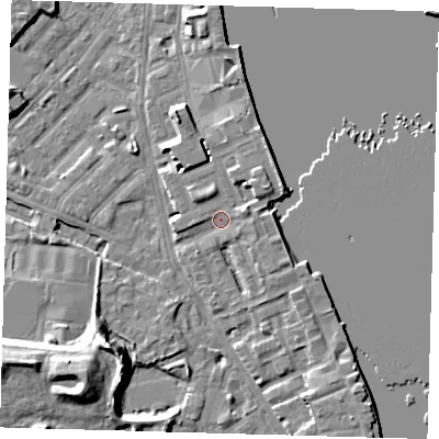 Shaded relief map of the ground around E143UU, computed from Environment Agency LiDAR. The ground here sits at about 4 m above sea level and falls 12 m across the surrounding 800 m. Surface water reaching this point runs off ground lying to the east-north-east, 2.4 m higher.