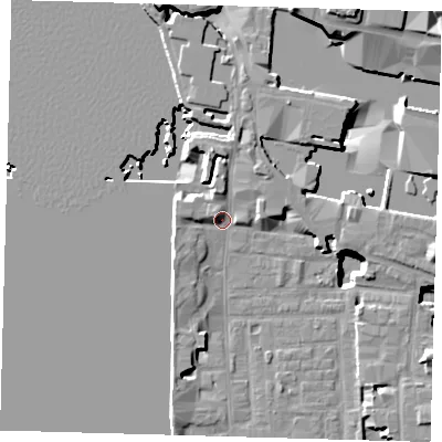 Shaded relief map of the ground around E148LB, computed from Environment Agency LiDAR. The ground here sits at about 4 m above sea level and falls 21 m across the surrounding 800 m. Surface water reaching this point runs off ground lying to the north, 4.2 m higher.