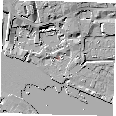 Shaded relief map of the ground around E1W1LU, computed from Environment Agency LiDAR. The ground here sits at about 5 m above sea level and falls 13 m across the surrounding 800 m. Surface water reaching this point runs off ground lying to the north-north-west, 11.4 m higher.