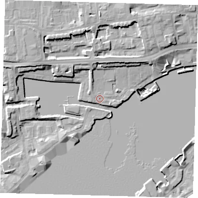 Shaded relief map of the ground around E1W3TD, computed from Environment Agency LiDAR. The ground here sits at about 5 m above sea level and falls 13 m across the surrounding 800 m. Surface water reaching this point runs off ground lying to the north-north-east, 7.2 m higher.