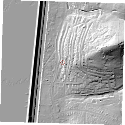 Shaded relief map of the ground around E47QE, computed from Environment Agency LiDAR. The ground here sits at about 18 m above sea level and falls 56 m across the surrounding 800 m. Surface water reaching this point runs off ground lying to the east-north-east, 13.1 m higher.