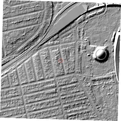 Shaded relief map of the ground around E62AP, computed from Environment Agency LiDAR. The ground here sits at about 5 m above sea level and falls 11 m across the surrounding 800 m. Surface water reaching this point runs off ground lying to the south, 1.8 m higher.