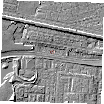 Shaded relief map of the ground around E65JL, computed from Environment Agency LiDAR. The ground here sits at about 1 m above sea level and falls 9 m across the surrounding 800 m. Surface water reaching this point runs off ground lying to the north, 7.8 m higher.