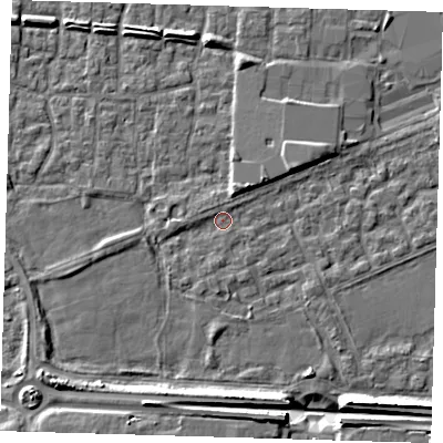 Shaded relief map of the ground around E65QR, computed from Environment Agency LiDAR. The ground here sits at about 2 m above sea level and falls 9 m across the surrounding 800 m. Surface water reaching this point runs off ground lying to the south, 1.4 m higher.