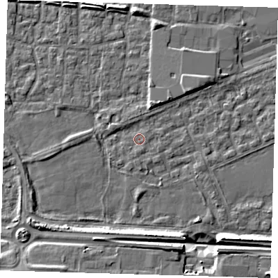 Shaded relief map of the ground around E65QS, computed from Environment Agency LiDAR. The ground here sits at about 2 m above sea level and falls 9 m across the surrounding 800 m. Surface water reaching this point runs off ground lying to the south, 1.3 m higher.