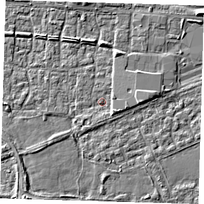Shaded relief map of the ground around E65RS, computed from Environment Agency LiDAR. The ground here sits at about 1 m above sea level and falls 6 m across the surrounding 800 m. Surface water reaching this point runs off ground lying to the east, 3.9 m higher.