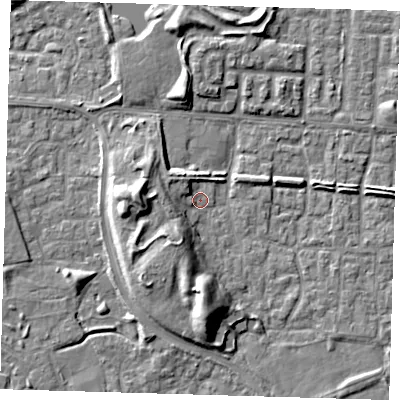 Shaded relief map of the ground around E65SY, computed from Environment Agency LiDAR. The ground here sits at about 1 m above sea level and falls 10 m across the surrounding 800 m. Surface water reaching this point runs off ground lying to the west, 4.6 m higher.