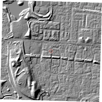Shaded relief map of the ground around E65TL, computed from Environment Agency LiDAR. The ground here sits at about 1 m above sea level and falls 9 m across the surrounding 800 m. Surface water reaching this point runs off ground lying to the south-south-east, 2.7 m higher.