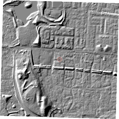 Shaded relief map of the ground around E65TP, computed from Environment Agency LiDAR. The ground here sits at about 1 m above sea level and falls 9 m across the surrounding 800 m. Surface water reaching this point runs off ground lying to the south-south-west, 8.8 m higher.