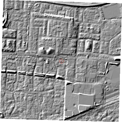 Shaded relief map of the ground around E65TS, computed from Environment Agency LiDAR. The ground here sits at about 1 m above sea level and falls 6 m across the surrounding 800 m. Surface water reaching this point runs off ground lying to the east-north-east, 0.9 m higher.