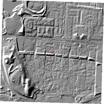 Shaded relief map of the ground around E65TW, computed from Environment Agency LiDAR. The ground here sits at about 1 m above sea level and falls 9 m across the surrounding 800 m. Surface water reaching this point runs off ground lying to the west-south-west, 2.2 m higher.