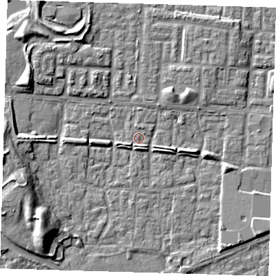 Shaded relief map of the ground around E65TX, computed from Environment Agency LiDAR. The ground here sits at about 1 m above sea level and falls 9 m across the surrounding 800 m. Surface water reaching this point runs off ground lying to the south-west, 8.8 m higher.