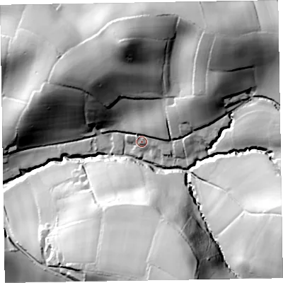 Shaded relief map of the ground around EX100AX, computed from Environment Agency LiDAR. The ground here sits at about 63 m above sea level and falls 77 m across the surrounding 800 m. Surface water reaching this point runs off ground lying to the north-east, 12.9 m higher.