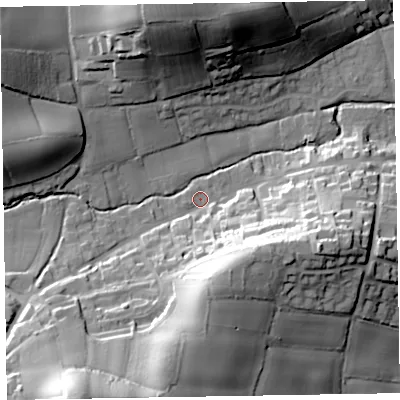 Shaded relief map of the ground around EX100DT, computed from Environment Agency LiDAR. The ground here sits at about 33 m above sea level and falls 48 m across the surrounding 800 m. Surface water reaching this point runs off ground lying to the south-south-east, 27.3 m higher.