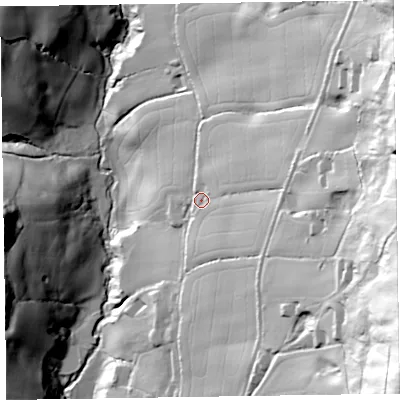 Shaded relief map of the ground around EX100QJ, computed from Environment Agency LiDAR. The ground here sits at about 110 m above sea level and falls 122 m across the surrounding 800 m. Surface water reaching this point runs off ground lying to the east-north-east, 30.9 m higher.