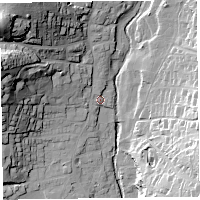 Shaded relief map of the ground around EX108UL, computed from Environment Agency LiDAR. The ground here sits at about 12 m above sea level and falls 60 m across the surrounding 800 m. Surface water reaching this point runs off ground lying to the north, 2.7 m higher.