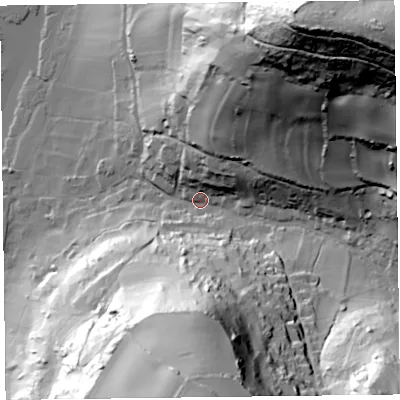Shaded relief map of the ground around EX124AN, computed from Environment Agency LiDAR. The ground here sits at about 12 m above sea level and falls 132 m across the surrounding 800 m. Surface water reaching this point runs off ground lying to the north-east, 122.7 m higher.