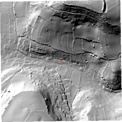 Shaded relief map of the ground around EX124AT, computed from Environment Agency LiDAR. The ground here sits at about 16 m above sea level and falls 131 m across the surrounding 800 m. Surface water reaching this point runs off ground lying to the north-east, 121.3 m higher.
