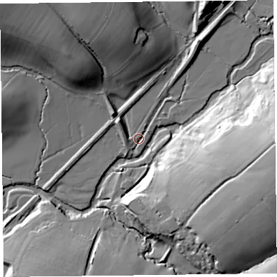 Shaded relief map of the ground around EX137LW, computed from Environment Agency LiDAR. The ground here sits at about 33 m above sea level and falls 42 m across the surrounding 800 m. Surface water reaching this point runs off ground lying to the north, 22.9 m higher.
