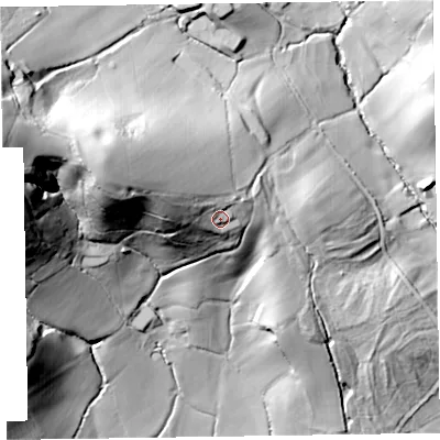 Shaded relief map of the ground around EX144TG, computed from Environment Agency LiDAR. The ground here sits at about 130 m above sea level and falls 75 m across the surrounding 800 m. Surface water reaching this point runs off ground lying to the west-north-west, 12.6 m higher.