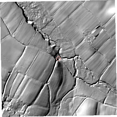Shaded relief map of the ground around EX153NA, computed from Environment Agency LiDAR. The ground here sits at about 104 m above sea level and falls 33 m across the surrounding 800 m. Surface water reaching this point runs off ground lying to the north-east, 28.5 m higher.
