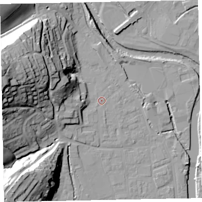 Shaded relief map of the ground around EX165LB, computed from Environment Agency LiDAR. The ground here sits at about 63 m above sea level and falls 53 m across the surrounding 800 m. Surface water reaching this point runs off ground lying to the west, 7.4 m higher.