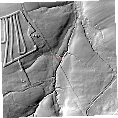 Shaded relief map of the ground around EX203AL, computed from Environment Agency LiDAR. The ground here sits at about 132 m above sea level and falls 42 m across the surrounding 800 m. Surface water reaching this point runs off ground lying to the south-west, 33.5 m higher.