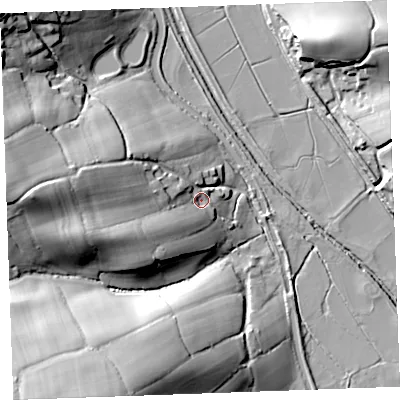 Shaded relief map of the ground around EX230LS, computed from Environment Agency LiDAR. The ground here sits at about 12 m above sea level and falls 43 m across the surrounding 800 m. Surface water reaching this point runs off ground lying to the west, 27.7 m higher.