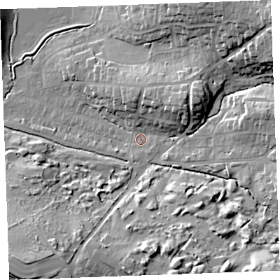 Shaded relief map of the ground around EX238RN, computed from Environment Agency LiDAR. The ground here sits at about 12 m above sea level and falls 30 m across the surrounding 800 m. Surface water reaching this point runs off ground lying to the north-east, 25.3 m higher.