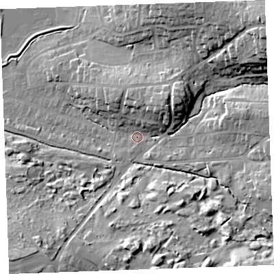 Shaded relief map of the ground around EX238RW, computed from Environment Agency LiDAR. The ground here sits at about 12 m above sea level and falls 32 m across the surrounding 800 m. Surface water reaching this point runs off ground lying to the north-east, 27.3 m higher.
