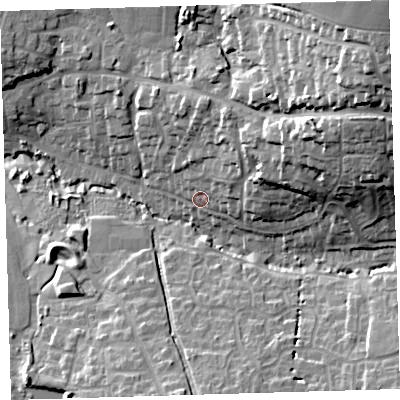 Shaded relief map of the ground around EX312JY, computed from Environment Agency LiDAR. The ground here sits at about 18 m above sea level and falls 43 m across the surrounding 800 m. Surface water reaching this point runs off ground lying to the north-east, 9.4 m higher.