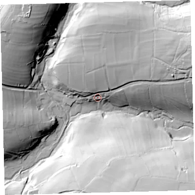 Shaded relief map of the ground around EX314TT, computed from Environment Agency LiDAR. The ground here sits at about 264 m above sea level and falls 77 m across the surrounding 800 m. Surface water reaching this point runs off ground lying to the east-north-east, 51.9 m higher.