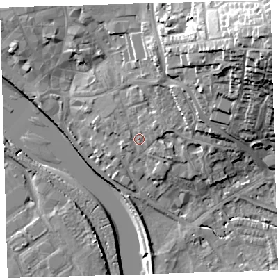 Shaded relief map of the ground around EX328JA, computed from Environment Agency LiDAR. The ground here sits at about 9 m above sea level and falls 38 m across the surrounding 800 m. Surface water reaching this point runs off ground lying to the north-east, 2.1 m higher.