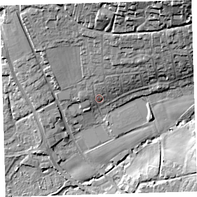 Shaded relief map of the ground around EX332HR, computed from Environment Agency LiDAR. The ground here sits at about 12 m above sea level and falls 33 m across the surrounding 800 m. Surface water reaching this point runs off ground lying to the north, 6.7 m higher.