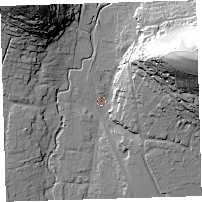 Shaded relief map of the ground around EX332JA, computed from Environment Agency LiDAR. The ground here sits at about 12 m above sea level and falls 84 m across the surrounding 800 m. Surface water reaching this point runs off ground lying to the east-north-east, 73.1 m higher.