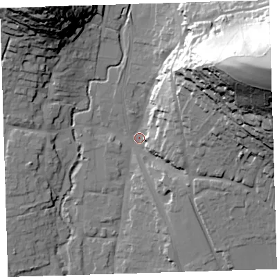 Shaded relief map of the ground around EX332JD, computed from Environment Agency LiDAR. The ground here sits at about 12 m above sea level and falls 86 m across the surrounding 800 m. Surface water reaching this point runs off ground lying to the east-north-east, 81.6 m higher.