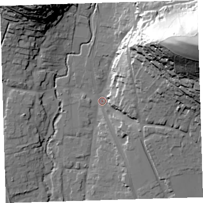 Shaded relief map of the ground around EX332JF, computed from Environment Agency LiDAR. The ground here sits at about 12 m above sea level and falls 86 m across the surrounding 800 m. Surface water reaching this point runs off ground lying to the east-north-east, 81.1 m higher.