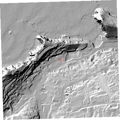 Shaded relief map of the ground around EX348AH, computed from Environment Agency LiDAR. The ground here sits at about 12 m above sea level and falls 77 m across the surrounding 800 m. Surface water reaching this point runs off ground lying to the south-east, 63.4 m higher.