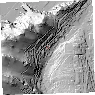 Shaded relief map of the ground around EX348AZ, computed from Environment Agency LiDAR. The ground here sits at about 38 m above sea level and falls 138 m across the surrounding 800 m. Surface water reaching this point runs off ground lying to the west-north-west, 92.3 m higher.