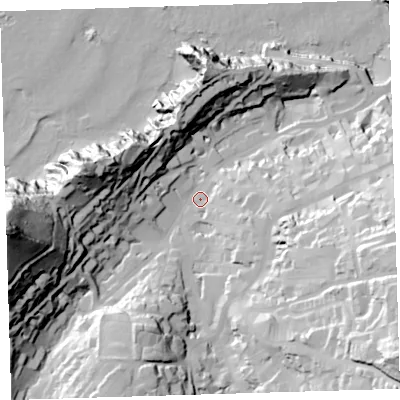 Shaded relief map of the ground around EX348BS, computed from Environment Agency LiDAR. The ground here sits at about 16 m above sea level and falls 99 m across the surrounding 800 m. Surface water reaching this point runs off ground lying to the south-east, 60.6 m higher.
